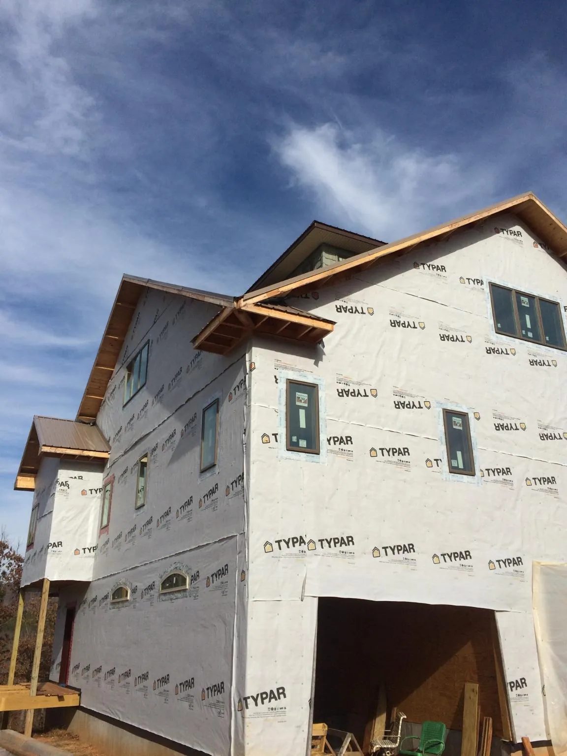 Stick built house wrapped in Typar with new roof framing and dormers in Ravenna